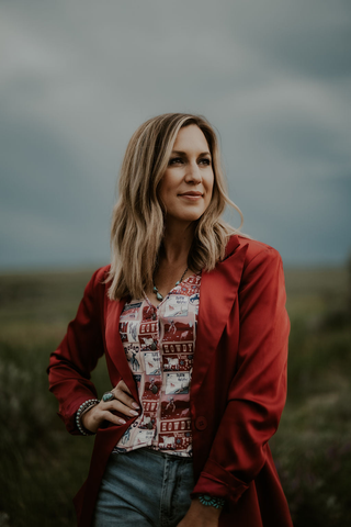 Model wearing americana vest with red blazer