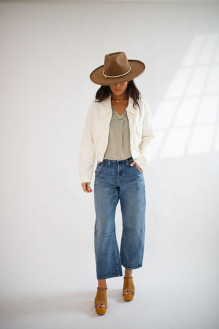 A display of jeans including skinny, straight, and bootcut styles in light, medium, and dark washes